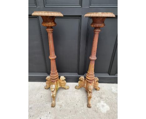 A large pair of Victorian cast iron tripod pedestals,&nbsp;with griffin feet, 122cm high. 