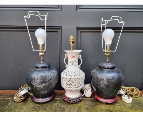 A pair of Chinese style pottery table lamps,&nbsp;height excluding fitting 22cm; together with another Chinese blanc de chine