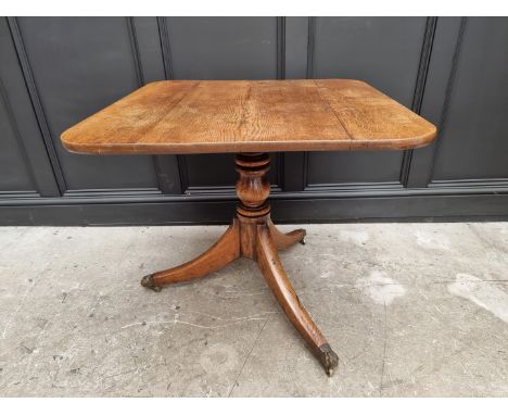 A 19th century oak tilt top tripod table, 81cm wide. 