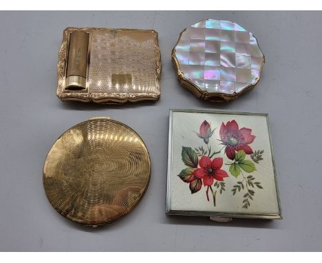 Four vintage compacts,&nbsp;to include a Stratton combined compact and lipstick; and a further Kigu example. 