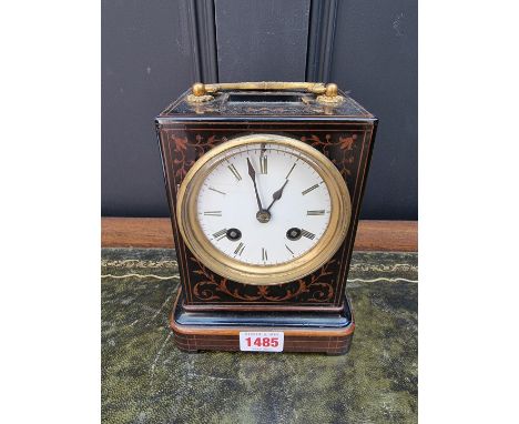 A late 19th century French marquetry mantel clock,&nbsp;21.5cm high, with pendulum.&nbsp; 
