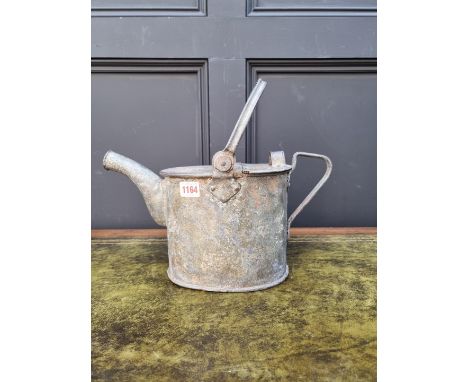 A galvanized hot water can, the base inscribed with crown and G R sypher, 33cm high.&nbsp; 