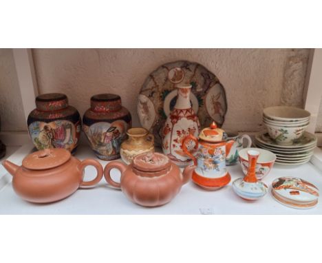 A mixed group of Chinese and Japanese pottery and porcelain, to include two yixing teapots and covers, (s.d.). 