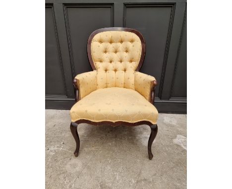 An ebonized and button upholstered chair.&nbsp; 