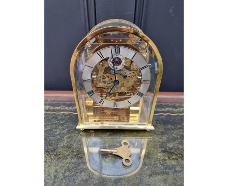 A Kieninger brass mantel clock, striking on eight straight gongs, 20cm high.&nbsp;&nbsp; 