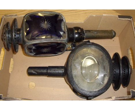 Cast metal coaching lamp with blue overlay glass panel and etched decoration and cast metal oval coaching lamp with clear gla