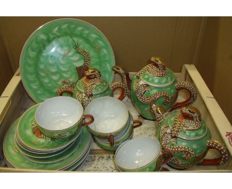 Oriental lithophane tea set with heavily moulded dragon handle, spout and finial