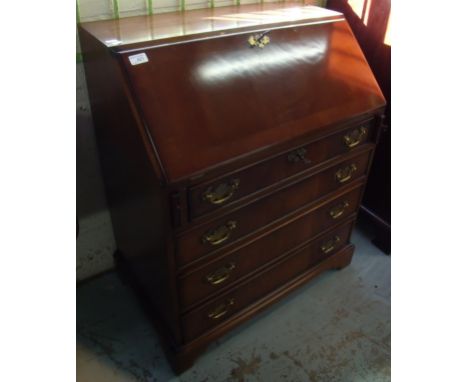 Mahogany bureau with fall front above four drawers on bracket feet 