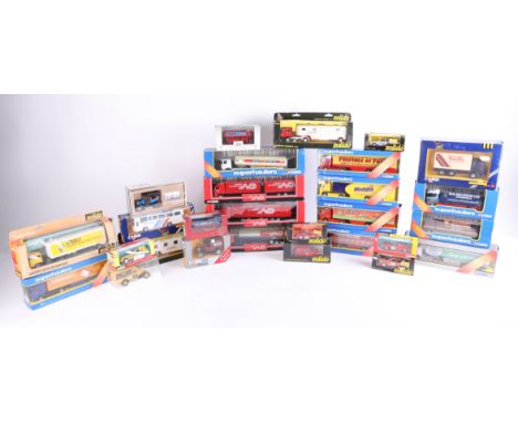 A mixed collection of models, including Corgi Superhaulers and Solido, with others, all boxed (approximately 25).