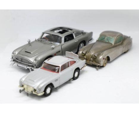 Three models, Kolner Jaguar German, Recent Corgi 007 Aston Martin DB5, with another Aston Martin DB5, all unboxed (3).