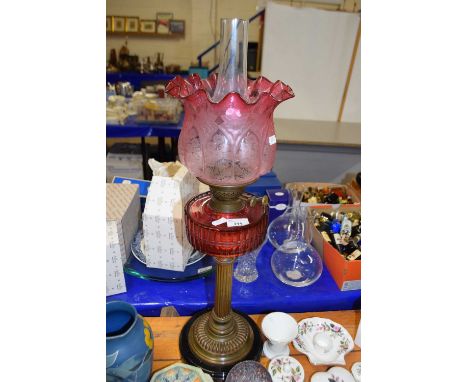 Victorian oil lamp with cranberry glass font and shade