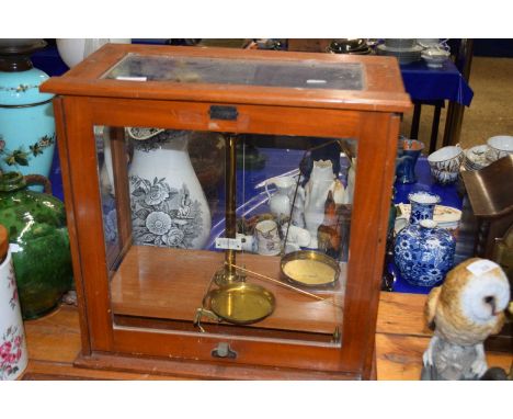 Chemists beam scales set in a glass case
