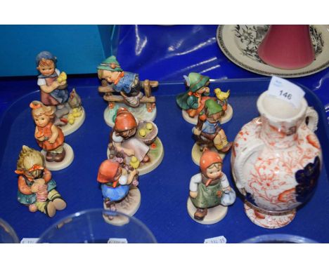 Tray of Goebel models of children, a pair of Pug dog models and a further vase