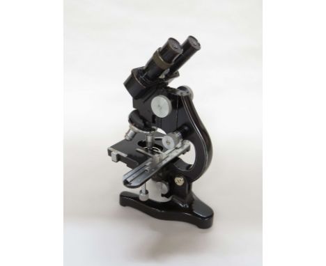 An Ernest Leitz Wetzlar Industrial binocular microscope, lacquered brass and metallic body, five eye pieces including 6x and 