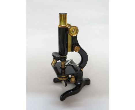 A W.Watson & Sons "Kima" No 66813 microscope, black lacquered with brassed fittings, 8x eyepiece and multiple objective lense