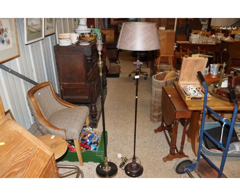A Corinthian column bronzed and brass standard lamp and another similar with shade 