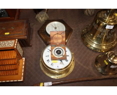 A Sestrel brass cased ships bulkhead type clock; a small wooden cased hand held travelling compass and an oak cased barometer