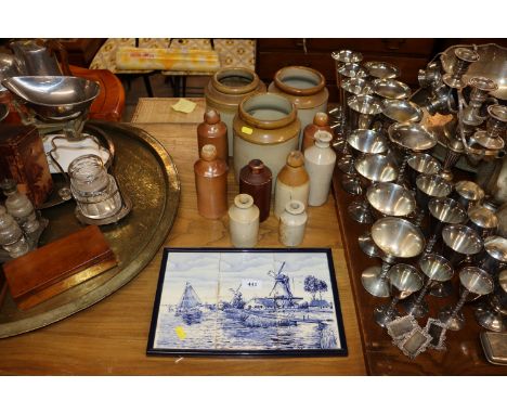 A Delft style tile picture and a quantity of stone glazed storage jars and bottles  