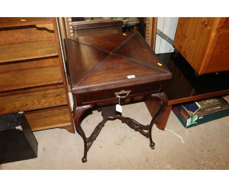 An Edwardian mahogany envelope card table