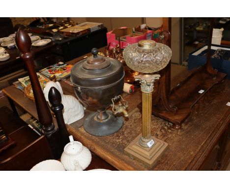 A copper samovar and a oil lamp base on Corinthian column 