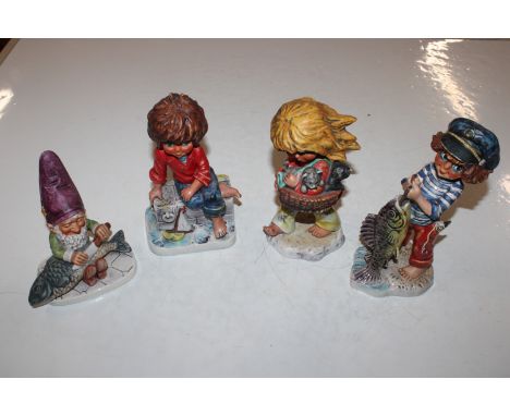 Four Goebel figures