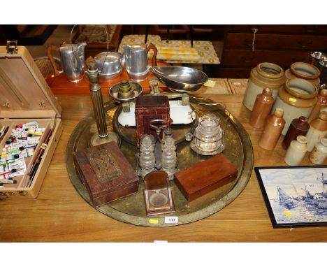 A large circular Eastern brass tray; a Corinthian column table lamp, a set of enamel scales, carriage clock case, cruet etc.