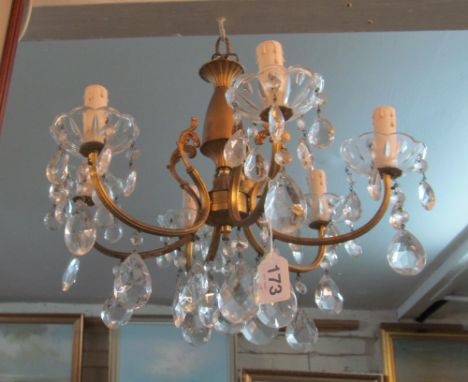 A six branch ceiling light with glass sconces and lustre drops