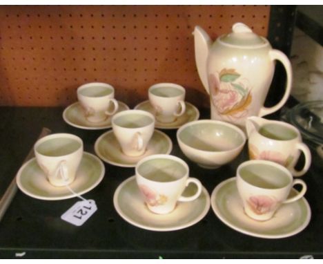 A Susie Cooper coffee set; coffee pot, sucrier, jug, six cups and saucers (one cup and succrier discoloured in side) crazing