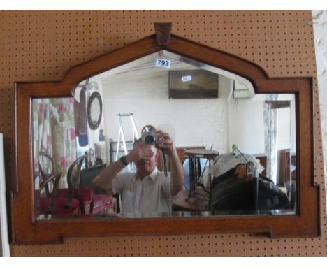 An oak arch top mirror