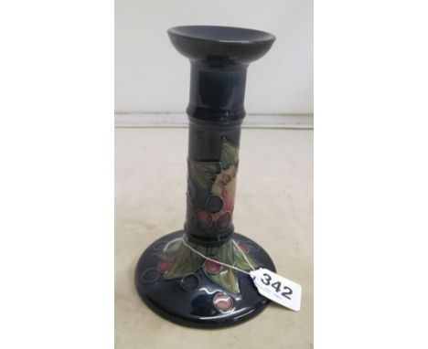 A Moorcroft candlestick bird and fruit on dark blue ground (boxed)