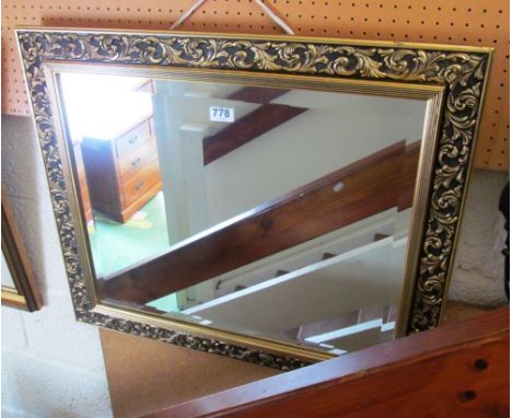 A gilt framed bevelled mirror