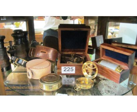 A modern compass boxed, two small telescopes boxed and other compasses