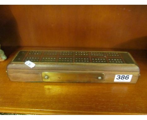 A treen and brass cribbage board with presentation plaque 'The Grenadier'
