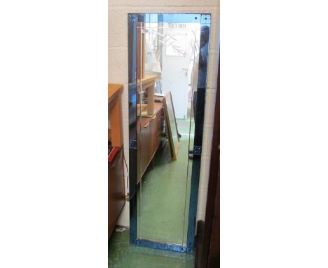 A long Art Deco blue bordered wall mirror