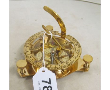 A modern brass compass