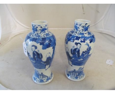 A pair of 19th Century Chinese blue and white vases decorated geisha and a man seated at a table, four character mark to base