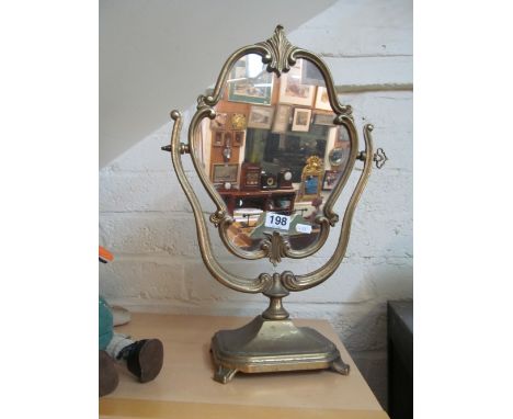 A brass swing mirror