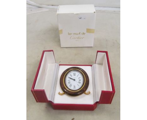 A Cartier Alarm clock winds and works