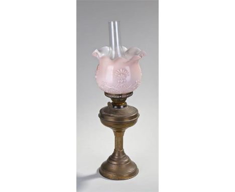 Victorian oil lamp, the copper base with reeded column, pink glass shade and glass chimney, 57cm high