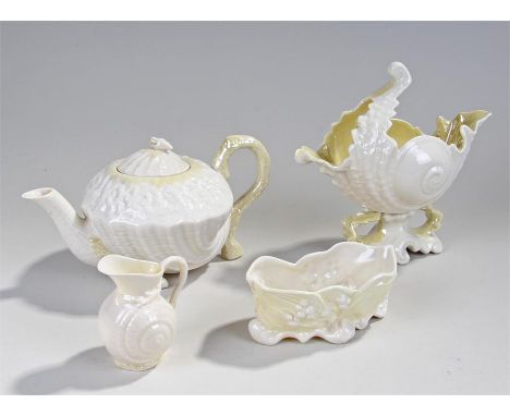 Four pieces of Belleek, to include a conch shell, a teapot, a jug and open vase, size range 6cm high to 21.5cm high (4)