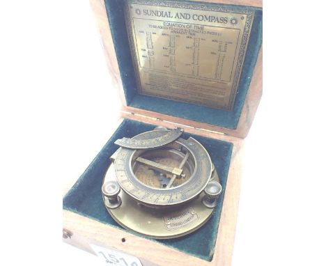 Boxed brass sundial and compass marked JH Steward