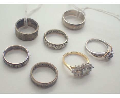 Seven hallmarked silver rings some with 9ct gold 