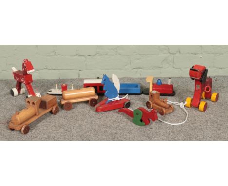 A collection of vintage wooden toys, to include pull along and 'Furgo' examples.  