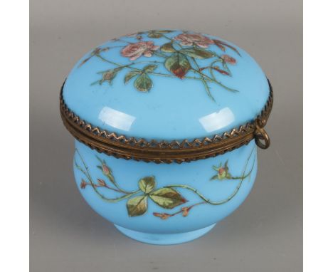 A Victorian blue glass trinket box featuring hand painted rose decoration.  