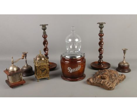 A quantity of collectables, containing a Smiths lantern mantel clock, lidded glass sweet jar, pair of turned candlesticks and