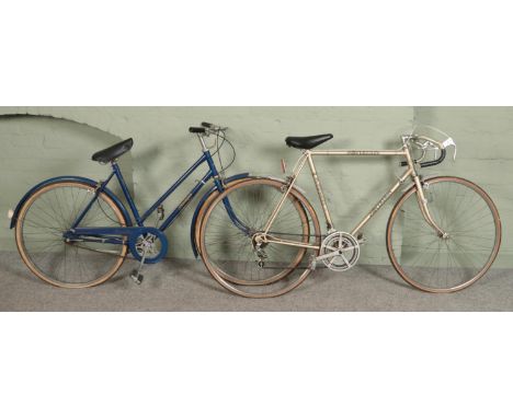 A vintage Elswick Sovereign racing/road bike along with a ladies Raleigh bike.  