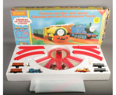 A boxed Hornby Thomas The Tank Engine clockwork train set. Thomas and Ben with Annie, Clarabel and the Troublesome Trucks.  