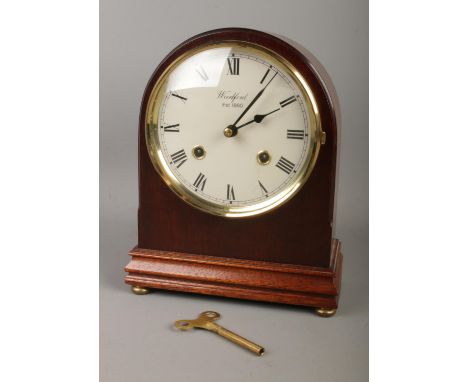 A Woodford 8 day, dome shaped mahogany mantel clock with Franz Hermle movement. Chiming half hourly on two bells. (22cm) In w