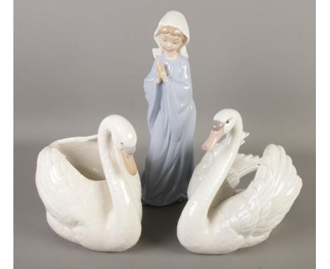 A Lladro swan along with Nao swan example and a young praying girl.  