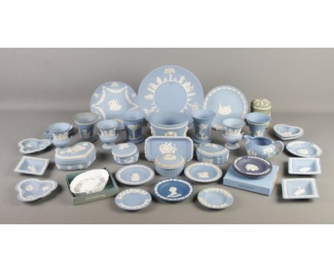 A collection of Wedgwood ceramics, mainly comprising of blue jasperware. To include plates, miniature urns, vases, lidded tri